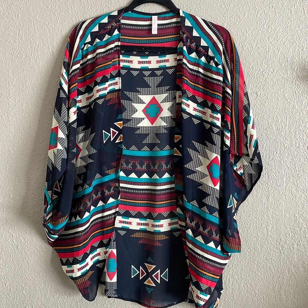 Light Aztec style cover over blouse